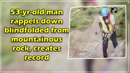53-year-old man rappels down blindfolded from mountainous rock, creates record