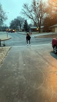 Girl Blissfully Ice Skates around Neighborhood