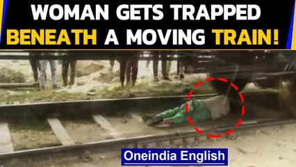 Rohtak woman escapes death despite being run over by a moving train: Watch the video| Oneindia News