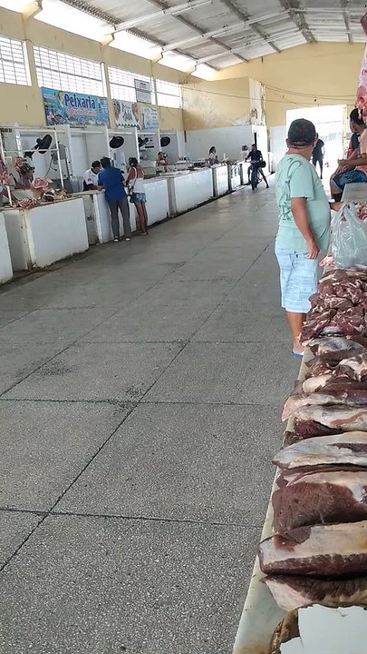 Man with Motorized Bike at Market Takes a Tumble