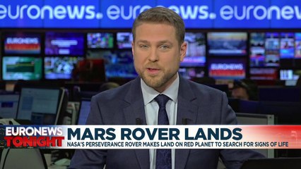 NASA rover returns its first images from Mars after historic landing