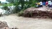 Men drag LPG cylinder on flooded street, flooding river in Pratapgarh, UP