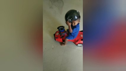 Small kid knows the importance of wearing helmet:)