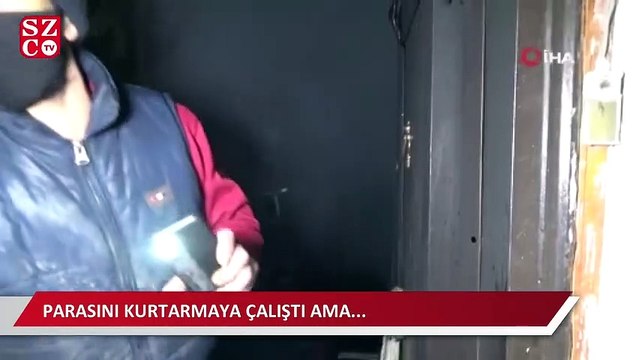 Alevlere teslim olan evine girip paralarını kurtarmaya çalıştı