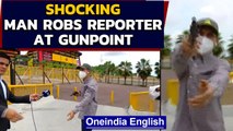 Man robs news reporter at gunpoint during live broadcast: Watch video | Oneindia News