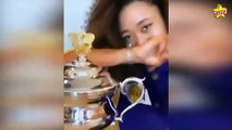Naomi Osaka rocks Lakers warm-up jacket while posing with Australian Open trophy