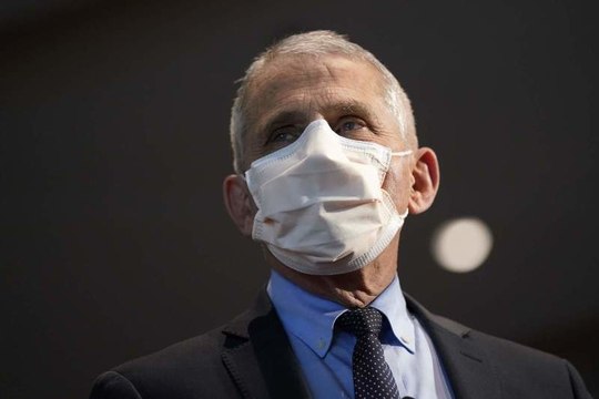 Dr. Fauci Says We May Still Be Wearing Face Masks in 2022