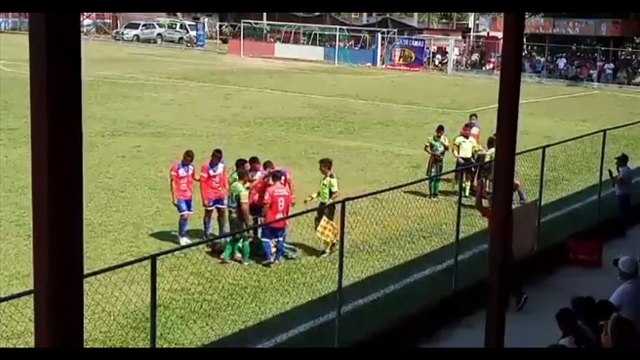 The best football dive: Player dives after faking being hit with fan-thrown stone