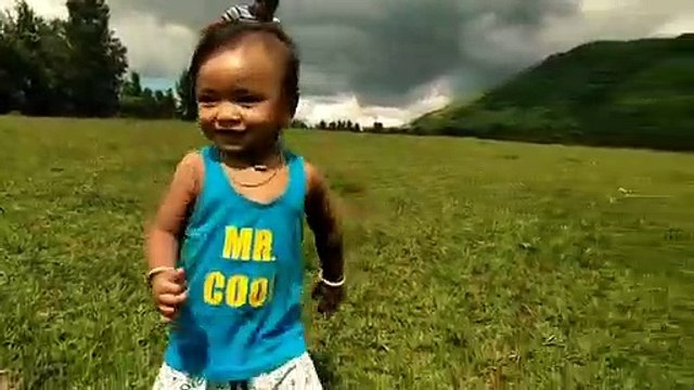 cute boy playing in ground
