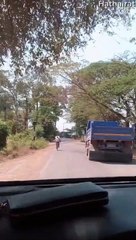 Truck Doesn't Want to Pass Grandma Carrying Stick on a Bike
