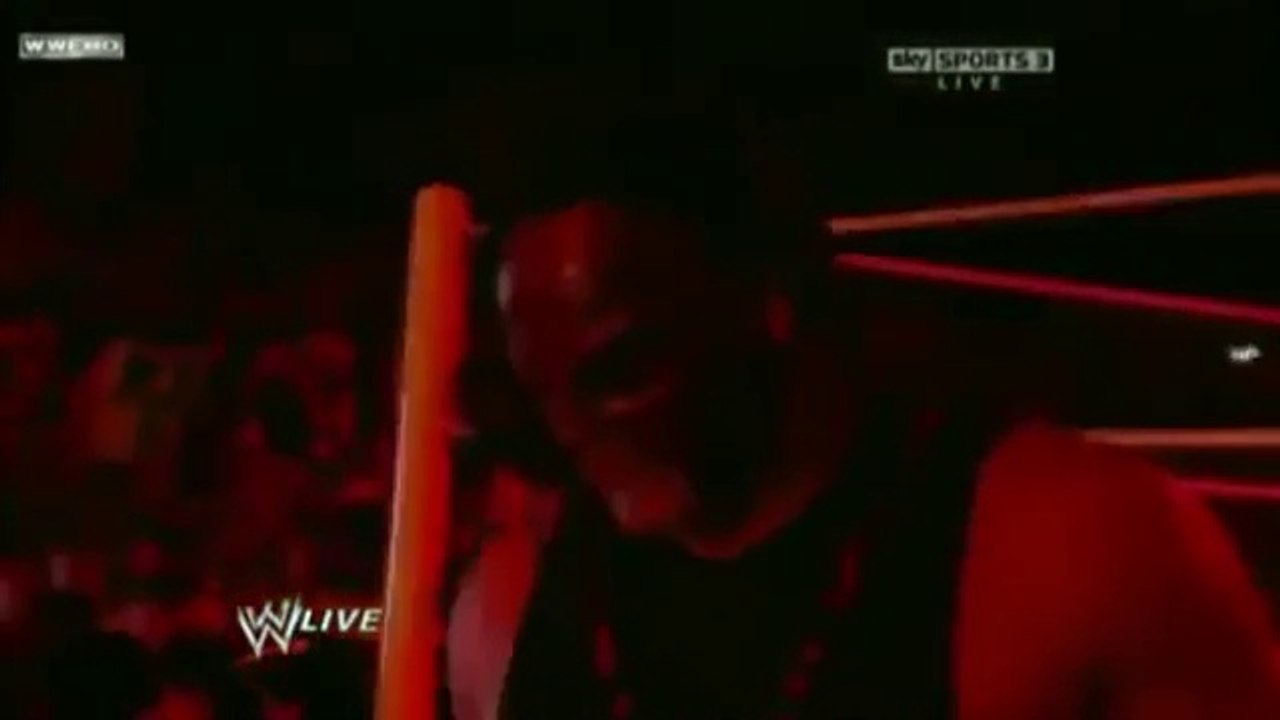 Kane_sets_the_ring_on_fire_-John_Cena