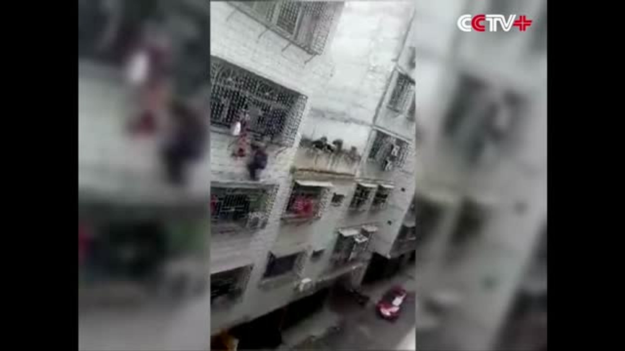 Two Men Save Girl Hanging by Neck From Fourth Storey Window
