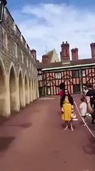 Queens guard pushes tourist in the back
