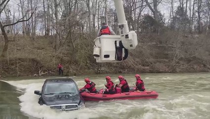 Tennessee rescuers save family after car slips off flooded bridge