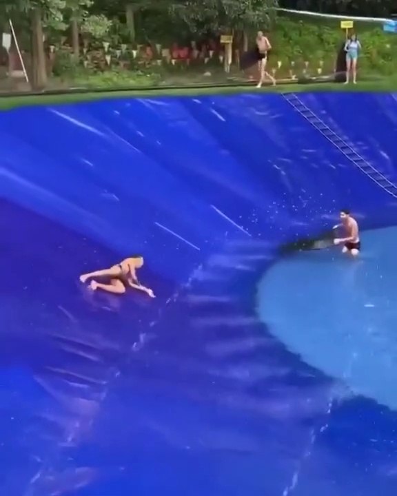 People enjoying in homemade water skating pool