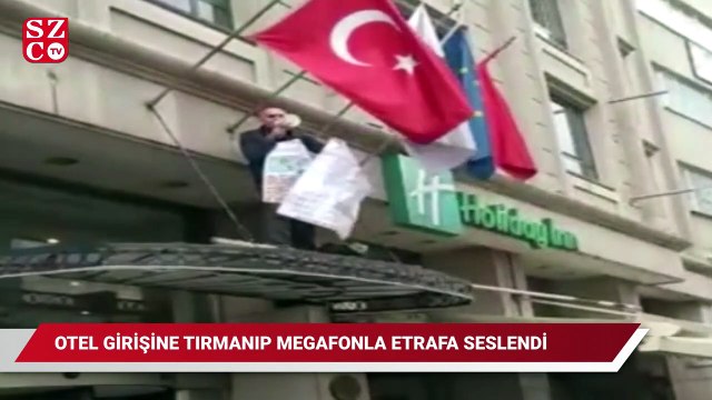 İstanbul’un göbeğinde ilginç olay: Otel girişine tırmanıp megafonla etrafa seslendi