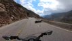 Biker With Cold Tires Lowslides on Road and Falls off Cliff's Edge