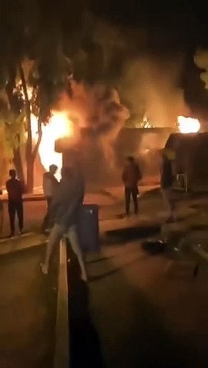 North African migrants burning down an asylum center in
