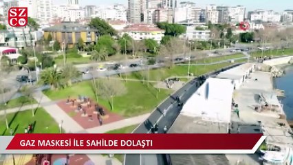 Gaz maskesiyle sahil turu