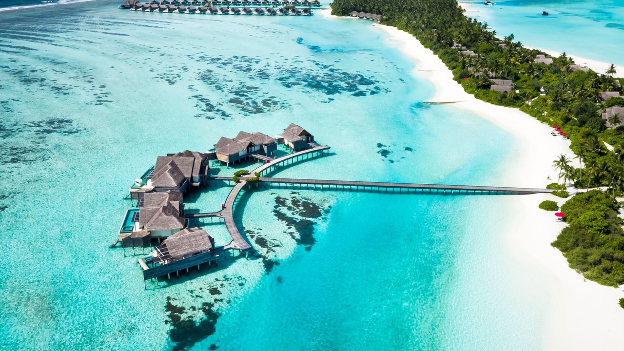 This Maldives Resort Has a Professional Surf Photographer to Catch Your Epic Shred