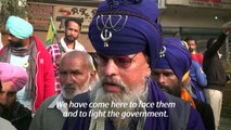 India's sword-wielding Sikh warriors guard protesting farmers