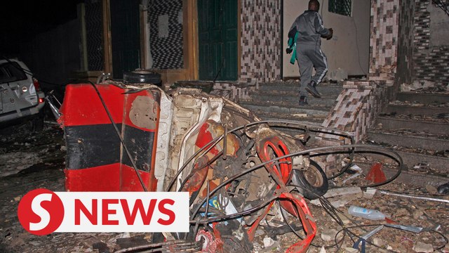 At least 20 killed by suicide car bomb near restaurant in Somalia capital