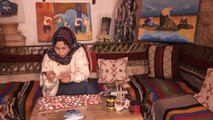 فنانة فلسطينية ترسم لوحاتها للمكفوفين