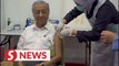 Dr M receives Covid-19 vaccine