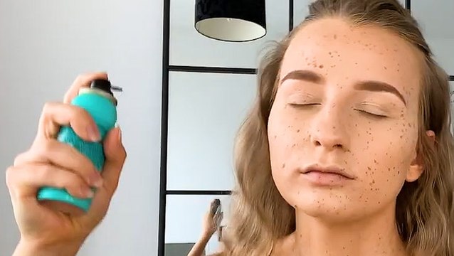 You can create fake freckles using a colored hair spray