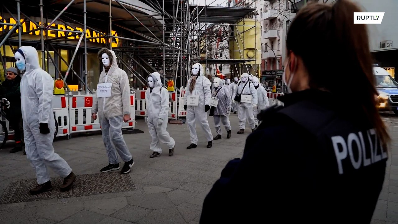 Coronavirus sceptics wearing 'ghost-like' uniforms march in Berlin