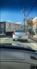 Semi Smashes Parked Car While Reversing