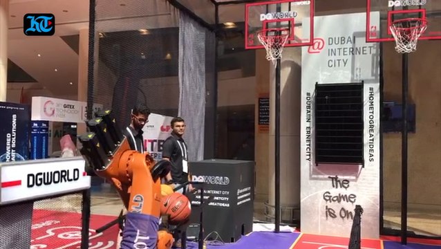 Robots and visitors shoot hoops side by side at Gitex Tech Week