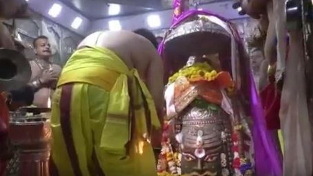 Priests offer prayers in Ujjain's Mahakal temple