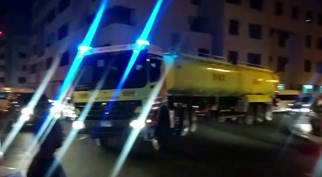 Fire engines rush to put out the fire in a Muraqqabat building