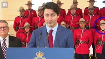 Two members of the Canadian Mounted Police faint behind Trudeau - Daily Mail