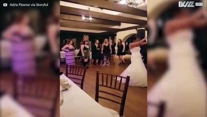 Woman catches wedding bouquet and her boyfriend's reaction is hilarious!