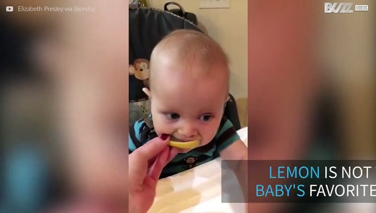 Baby tries lemon for the first time