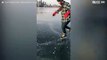 Man performs ice skating tricks on frozen Toronto lake