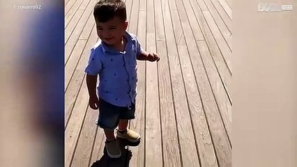 Little boy is afraid of his own shadow