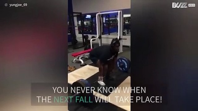 Muscleman trips while throwing his weight in gym!