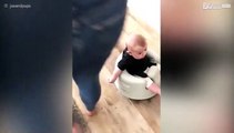 Baby rides a Roomba
