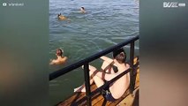 Dog joins friends in river and steals their ball!