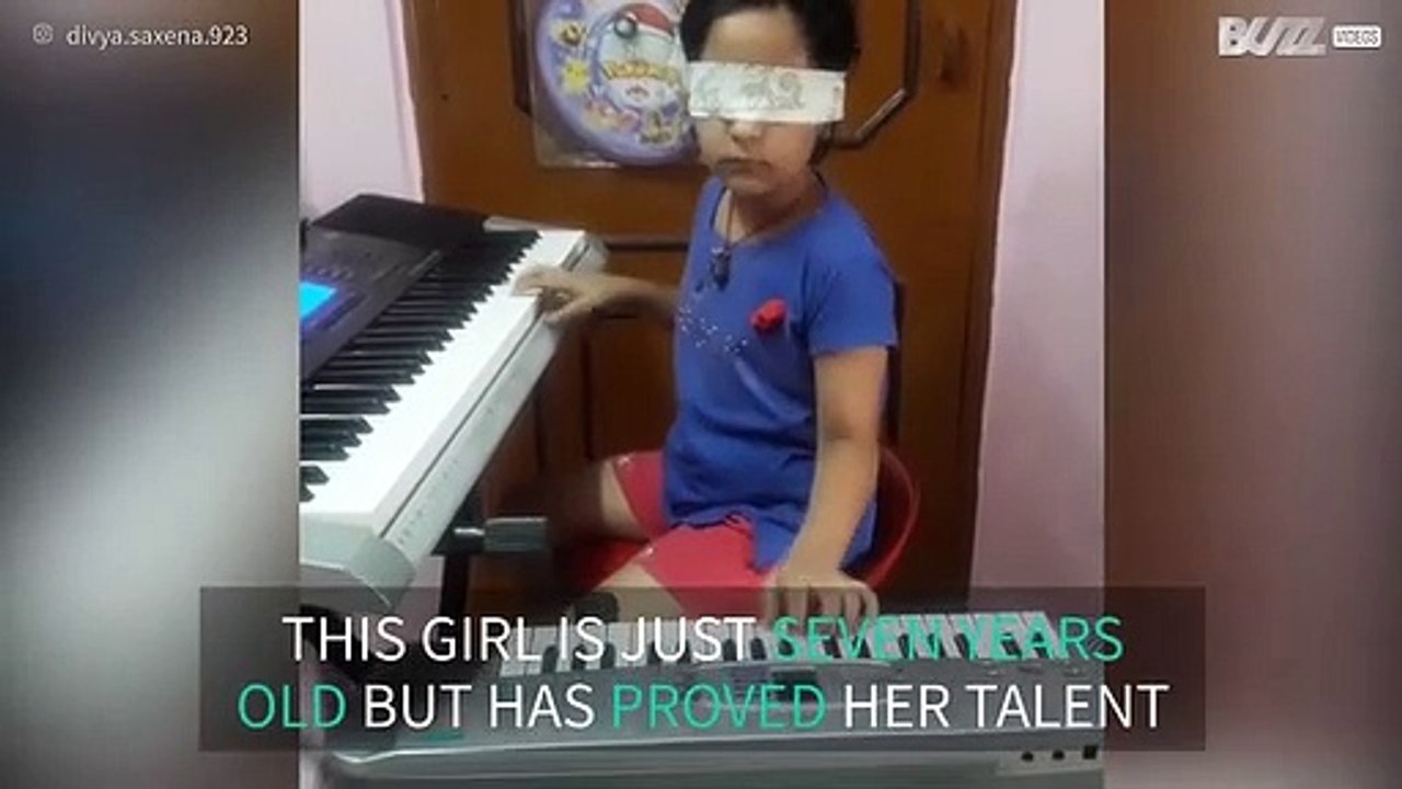 Talented girl plays piano blindfolded