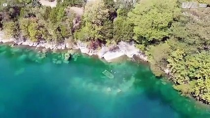 Buddies carry out underwater exploration of old quarry
