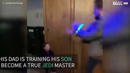 Toddler tries to imitate dad's Jedi trick