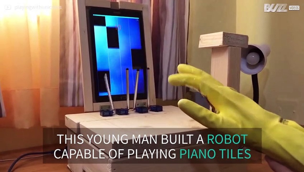 Robot plays piano on tablet