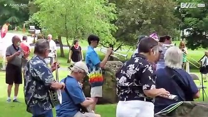 Orchestra plays and sings together to congratulate its oldest member