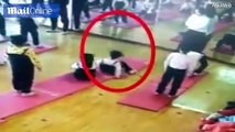 Little girl performs risky yoga pose during dance class