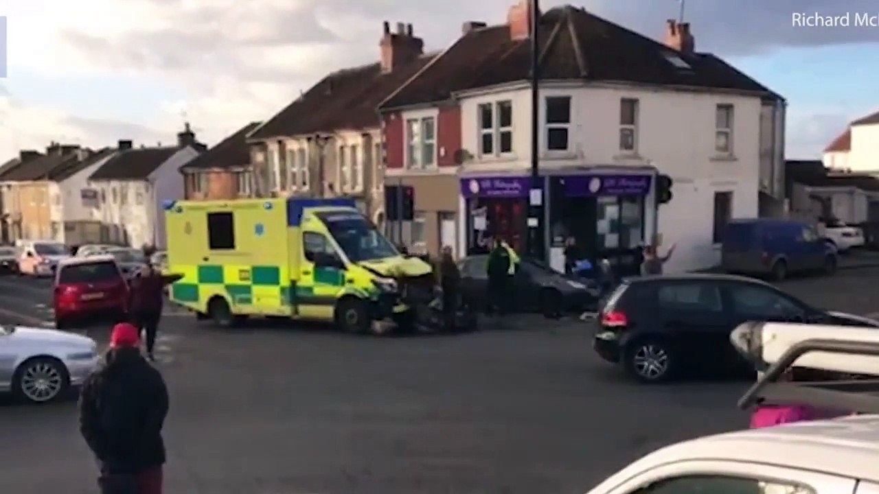 Ambulance racing emergency call collides van