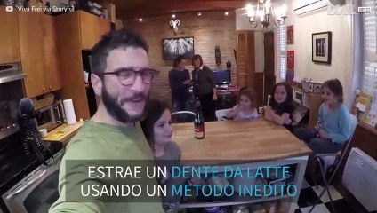 Come estrarre un dente da latte... con una bottiglia di spumante!